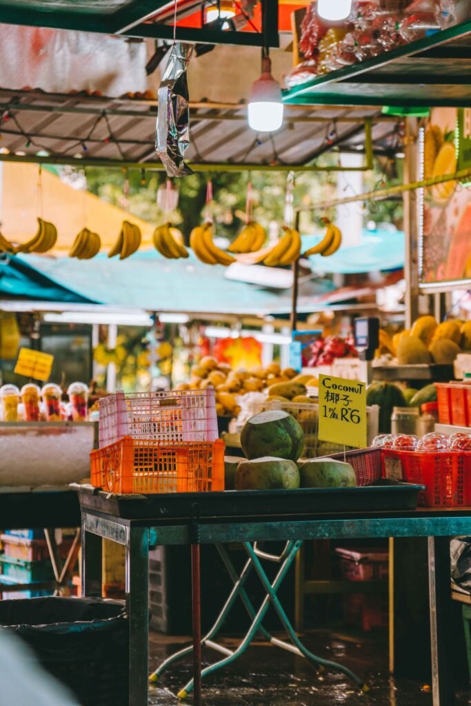 A busy outdoor market street in Kuala Lumpur